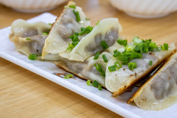 Pan fried dumplings with spring union