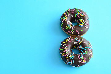 number eight made of chocolate donuts copy space 