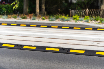 Asphalt road and boundary delineator for control traffic of city transport - obrazy, fototapety, plakaty