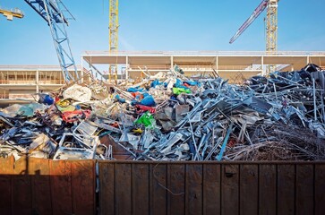 rusty container filled with scrap metal collected for recycling