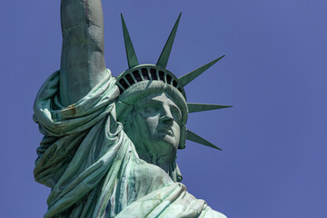 The great statue of liberty with its crown holding its torch, democratic symbol of New York (USA)...