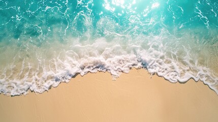 Fototapeta na wymiar Sand beach from above with light blue water wave and sun lights