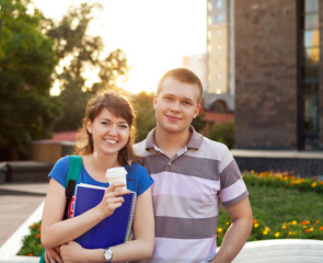 Cute young beautiful teen couple in city near university