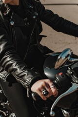 Fototapeta na wymiar Cropped vertical photo of a female motorcyclist on a powerful bike. The spirit of freedom and the headwind.