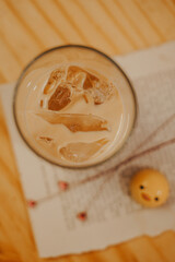 iced latte caramel in a beautiful glass mug in a coffee shop