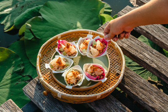 Miang Kham lotus petals-wrapped is a food that people is eaten as a snack. Lotus lotus petals are a new alternative to eating for health. Lotus flowers are not only edible. But also has many benefits.