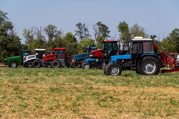 Agricultural tractors on a field