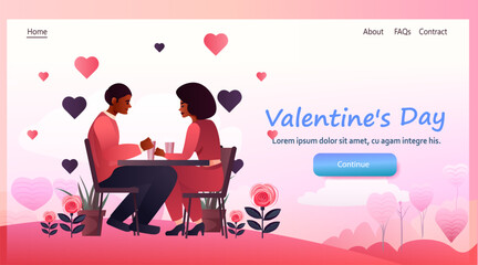 couple in love sitting at cafe table happy valentines day celebration concept copy space full length horizontal