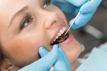 A patient in a dental chair expresses her gratitude to the doctor for the best dental care. A...