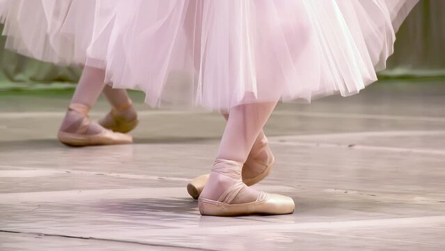 Ballerinas do synchronous movement in dance