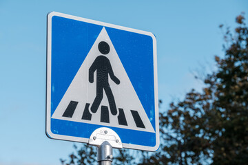 Closeup of an European style crosswalk warning sign.