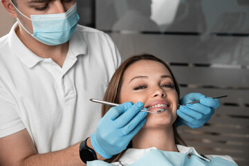 In the dental chair, the patient feels comfortable and reliable when the doctor uses the tools for high-quality treatment. The doctor, using his instruments carefully, provides the patient with