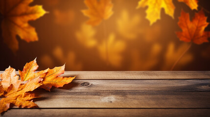 Naklejka na ściany i meble bokeh wooden table with orange fall leaves autumn natural