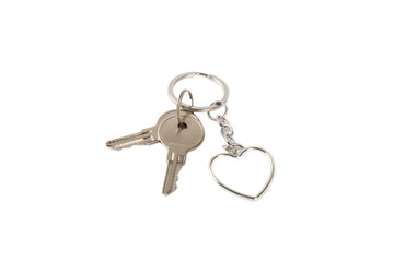 Heart-shaped keychain with key ring isolated on white background. Concepts for real estate and moving home or renting property. Buying a property. Mock-up keychain.Copy space.