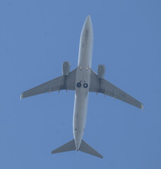 Low angle view of Airplane flying under blue sky