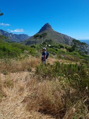 Fototapeta premium Man hiking in nature in front of Lions Head