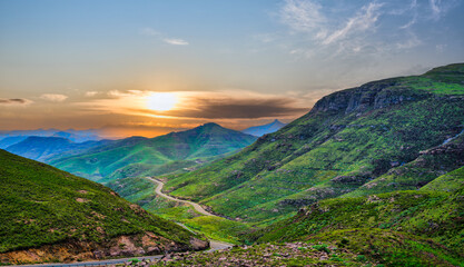A3 highway through a gorge surrounded by mountains during sunset in the highlands of Lesotho