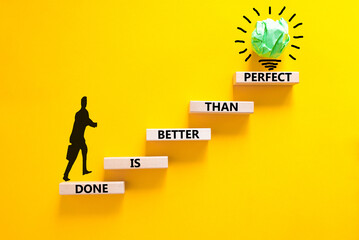 Done is better than perfect symbol. Concept words Done is better than perfect on wooden blocks....