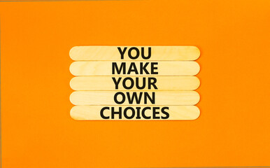 You make your own choice symbol. Concept words You make your own choice on wooden stick. Beautiful orange table orange background. Business you make your own choice concept. Copy space.