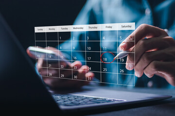 Time management concept. Businessman use laptop to manage time for effective work. Calendar on the virtual screen interface. Highlight appointment reminders and meeting agenda on the calendar. - obrazy, fototapety, plakaty