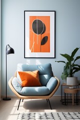 Blue armchair with orange pillow in front of framed abstract art