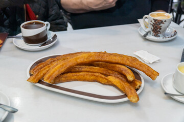 Traditional spanish churros on a plate