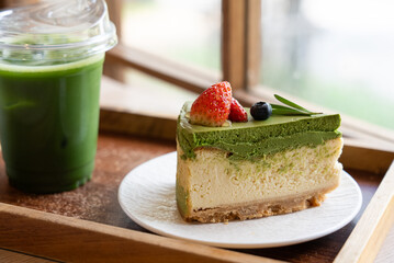 Green Tea Cheese Cake Served With Matcha Tea in Restaurant