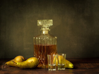 Antique-style still life with pears and alcohol whiskey. - 704461338