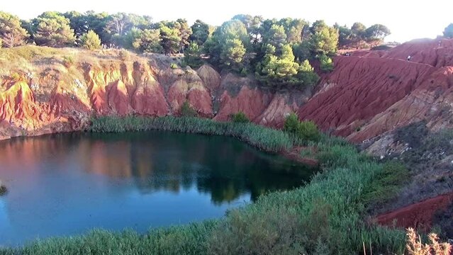 The small lake of the former bauxite quarry in Otranto, Lecce, Italy.
