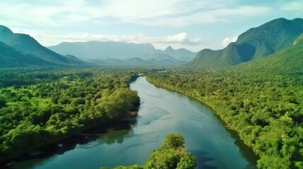 Fototapeta na wymiar Beautiful natural scenery of river in southeast Asia tropical green forest with mountains in background, aerial view drone shot.