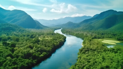 Naklejka na ściany i meble Beautiful natural scenery of river in southeast Asia tropical green forest with mountains in background, aerial view drone shot.