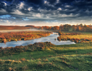 Autumn morning in the picturesque river valley. Autumn landscape with clouds. Nature of Ukraine