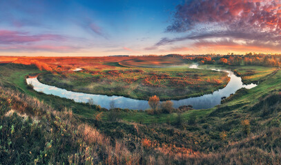 Autumn morning in the picturesque river valley. Autumn landscape with clouds. Nature of Ukraine