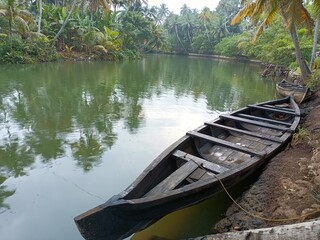 A canoe is a lightweight narrow water vessel, typically pointed at both ends and open on top, propelled by one or more seated or kneeling paddlers facing the direction of travel and using paddles