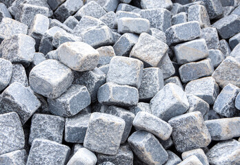Sidewalk gray stones, stones and cobblestones, construction of a path, road, sidewalk, pavement