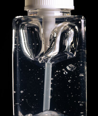 Transparent square bottle with thick liquid