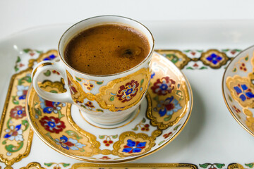 Traditional Turkish Coffee in elegant,gilded coffee cup,above view