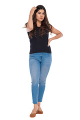 Young Indian girl wearing crochet top and jeans with elegant pose and expression