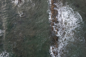 Seashore with green color water