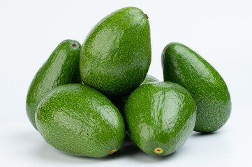 Many pretty avocados in pile