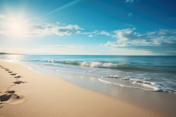 Fototapeta na wymiar Sunny beach with gentle waves under a clear blue sky