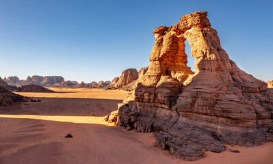 Landscape of the Red Tadrart in the Sahara Desert, Algeria. Aerial view of one of the arches of Tamesguida