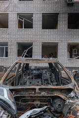 Shahed blew up houses. A bombed residential building and burnt cars after the strike. War in Ukraine, the city of Dnipro. Burnt out car.