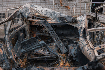 Shahed blew up houses. A bombed residential building and burnt cars after the strike. War in Ukraine, the city of Dnipro. Burnt out car.