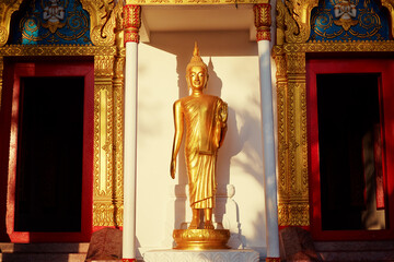 Golden statue of Buddha in thai temple.
