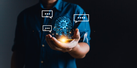 man holding smart AI chatbot and command prompt.Big data storage.Digital Artificial Intelligence technology disruption concept.We are implementing automated tech support and service in the business.