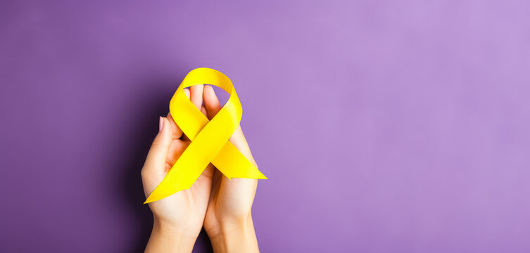yellow Ribbon against white background for endometriosis awareness campaign, suicide prevention , Childhood cancer.