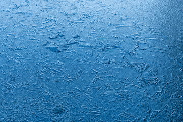 Beautiful frozen ice pond aerial view across snowy park landscape