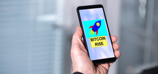 Bitcoin rise concept on a smartphone