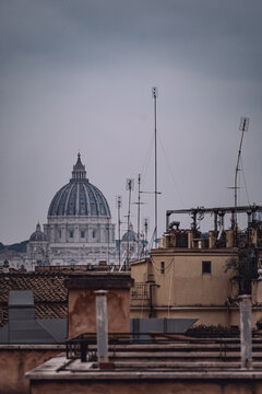 view of st. peter's dome from the rooftops of rome